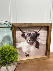 Highland Cow soaking in tub