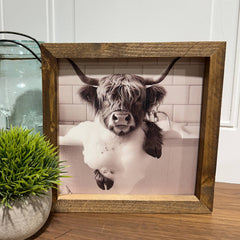 Highland Cow soaking in tub