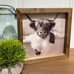 Highland Cow soaking in tub